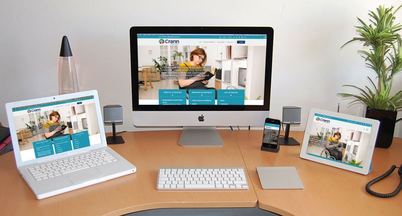 Responsiveness of Crann Centre website shown across a Desktop, Laptop, Tablet, and Mobile Phone.