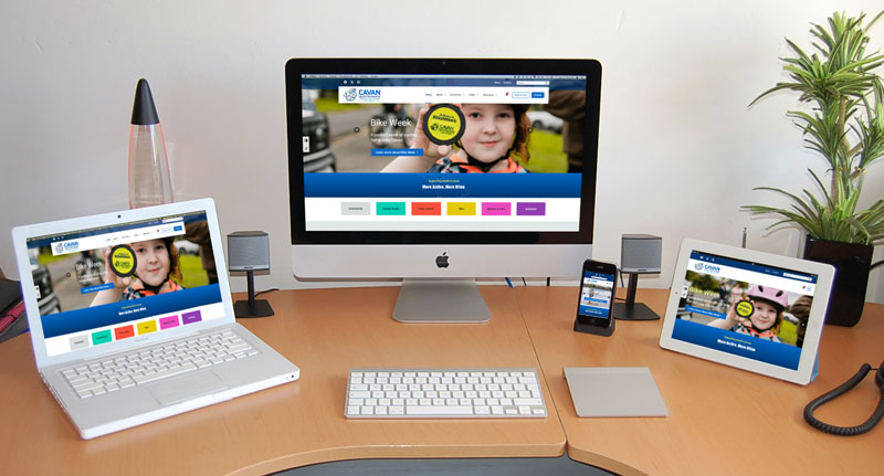 Cavan Sports Partnership - monitors depicting website responsiveness across multiple devices.